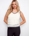 Elegant top with a V-neckline, featuring intricate crochet patterns for a sophisticated look by Charlie B.