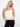 Fashionable V-neckline top with intricate crochet patterns and contrast trim accents by Charlie B.
