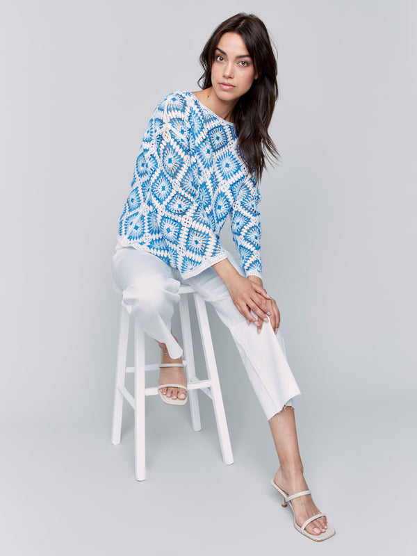 Blue and white crochet design with intricate patterns for a chic look by Charlie B.