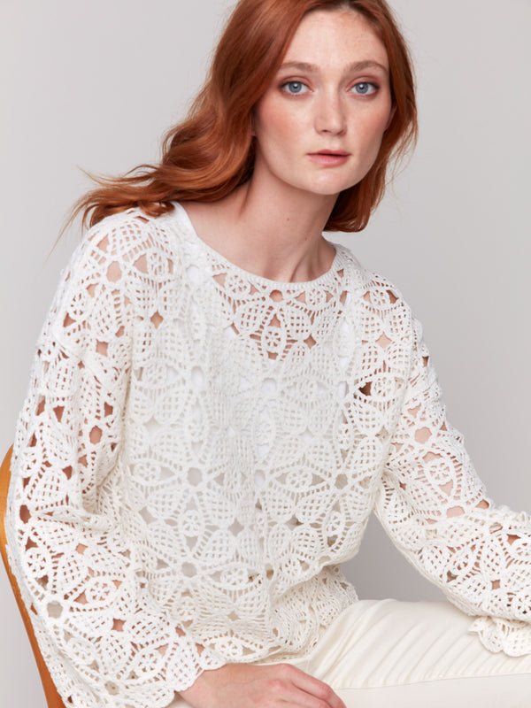 Fashionable crochet top in a soft, neutral shade by Charlie B.