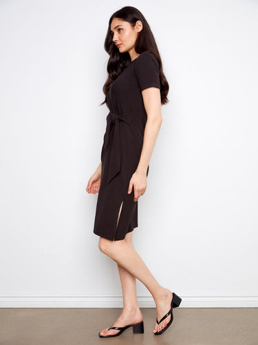 Chic mid-length black dress complete with an elegant waist tie detail by Charlie B.