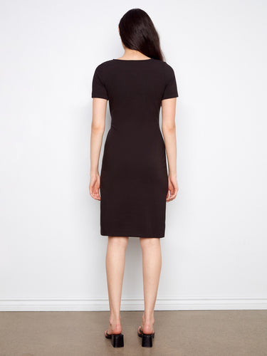 Classic mid-length black dress designed with simplicity and elegance in mind by Charlie B.