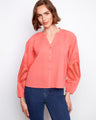 Coral blouse featuring a stand neckline and button-front closure, adding a touch of elegance to your wardrobe. By Charlie B.