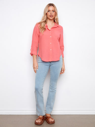 Featuring a chic button-front closure, this coral shirt is crafted from breathable 100% cotton for comfort. By Charlie B.