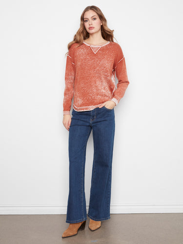 Long sleeves define this 100% cotton sweater, offering comfort and timeless fashion by Charlie B.