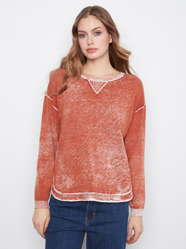 Rounded hem adds a touch of modernity to this classic washed finish sweater by Charlie B.