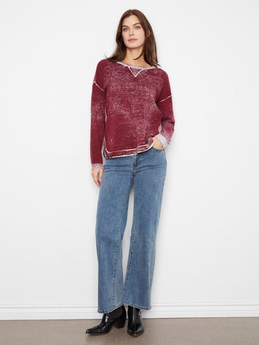 The long sleeves of this sweater provide warmth and versatility, making it an ideal choice for cooler days. Made with care by Charlie B.