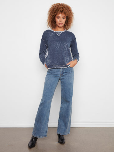 Long sleeves and ribbed cuffs enhance the relaxed fit of this versatile sweater by Charlie B.