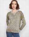 Olive sweater featuring a crew neckline, perfect for casual outings. Made from 100% cotton with a washed finish by Charlie B.