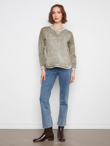 Comfy olive top with drop shoulders and long sleeves, ideal for layering in cooler weather. Crafted by Charlie B.