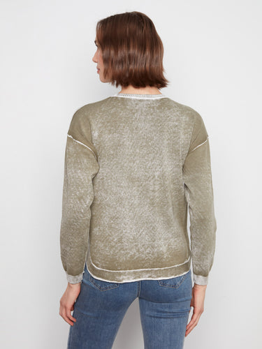 Olive cotton sweater showcasing its washed finish for an effortlessly chic look. A versatile piece by Charlie B.