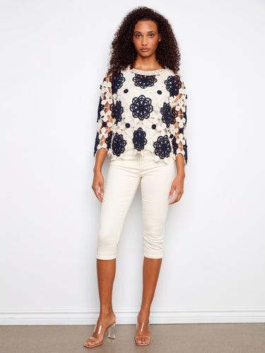 Chic navy crochet top with intricate design and 3/4 sleeves, perfect for casual wear by Charlie B.