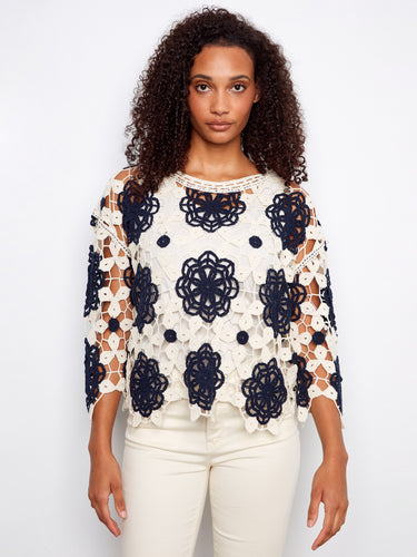 Stylish floral crochet top with a boat neckline, offering a unique look for all occasions by Charlie B.