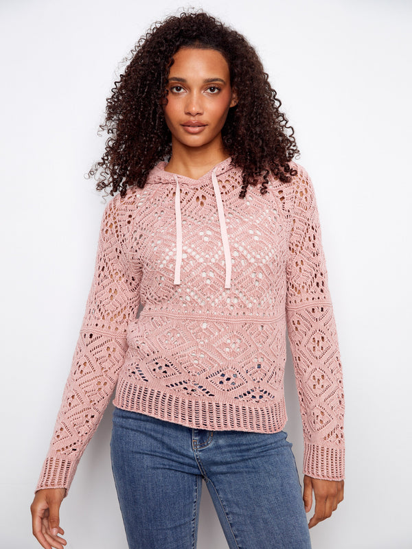 Stylish crochet sweater in pink with raglan sleeves, providing a relaxed fit perfect for casual outings by Charlie B.
