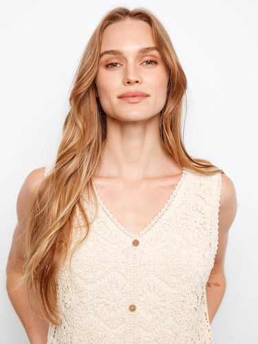 Stylish V-neckline enhances the elegant look of this sleeveless crochet midi dress, ideal for summer events by Charlie B.