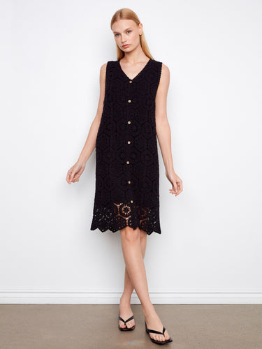 Chic crochet design adds texture and style to this knee-length black dress, ideal for versatile wear. By Charlie B.
