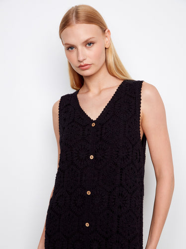 Decorative button detail enhances the sophisticated look of this lined black dress, making it a standout piece. By Charlie B.