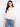 Elegant white blouse with scalloped hem and eyelet pattern. Features 3/4 sleeves and elastic cuffs for comfort by Charlie B.