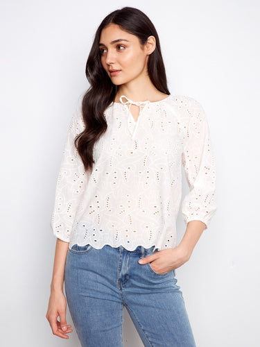 Stylish cotton blouse with elastic cuffs on 3/4 sleeves. Eyelet detailing enhances the look along with a scalloped hem by Charlie B.