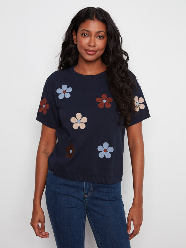 Navy top with a crew neck and floral design, made from soft 100% cotton for comfort. By Charlie B.