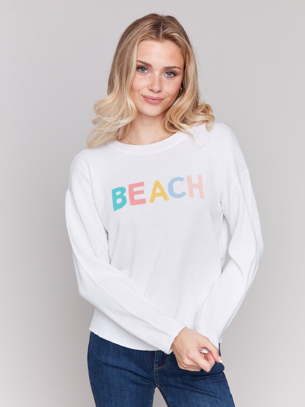 Elegant long-sleeve sweater showcasing a playful design by Charlie B.