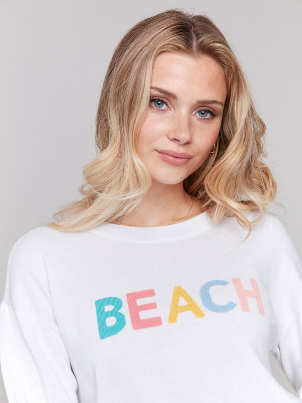 Comfortable white knitwear with striking chest print by Charlie B.