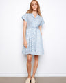 The dress features a classic shirt collar, adding a touch of sophistication to the overall look. Designed by Charlie B.