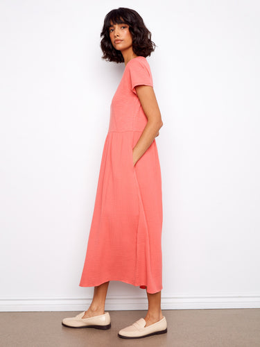 Designed with a timeless crew neckline, this coral dress offers effortless style and comfort in pure cotton by Charlie B.