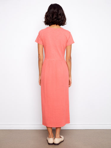 Featuring short sleeves and a relaxed fit, this coral midi dress is crafted from high-quality cotton fabric by Charlie B.