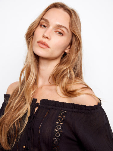 Stylish off-the-shoulder black blouse crafted from semi-sheer cotton fabric by Charlie B.