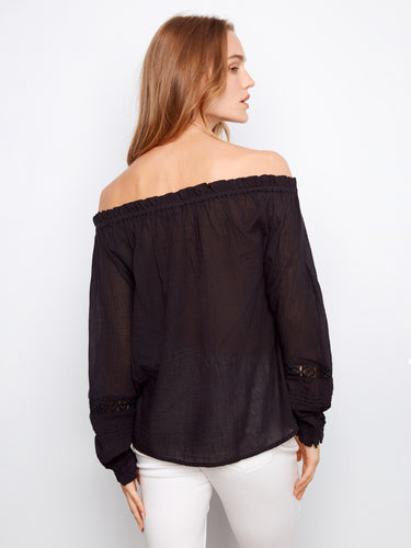 Chic black blouse showcasing exquisite openwork trim at the front for added elegance by Charlie B.