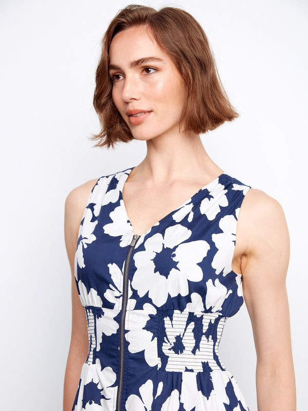 Elegant floral dress designed with hidden pockets and a classic front-zip closure for added convenience and flair. By Charlie B.