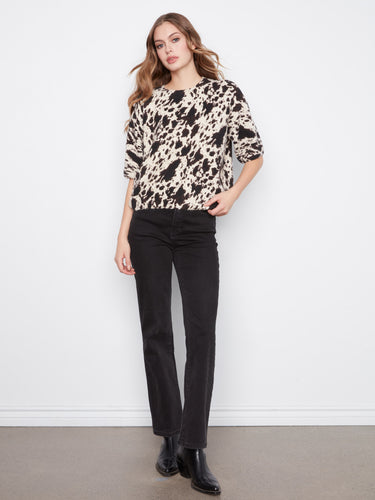 Elegant top in a relaxed fit, designed with balloon elbow sleeves and a trendy pattern for versatile styling by Charlie B.