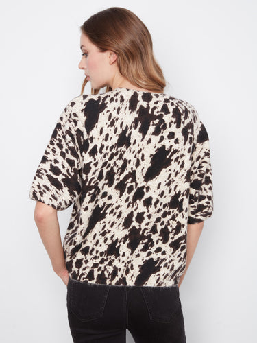 Stylish piece showcasing balloon elbow sleeves, perfect for adding flair to any casual or dressy outfit by Charlie B.