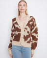 Cozy cardigan with a V-neck and fuzzy knit texture, perfect for layering. By Charlie B.