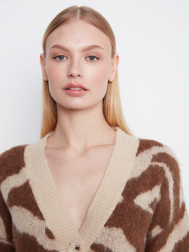Drop shoulder feature gives an elegant yet laid-back vibe to the sweater. By Charlie B.
