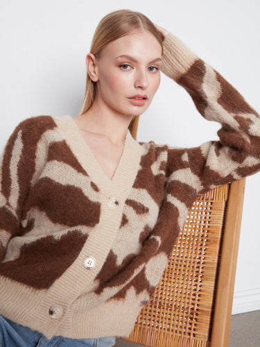 Relaxed fit cardigan ideal for casual outings or cozy days at home. By Charlie B.