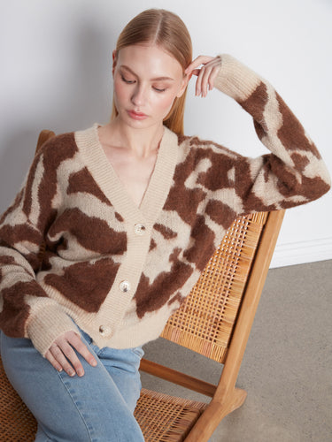 Button-front closure offers ease and style in this fashionable knitwear piece. By Charlie B.