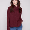 Cabernet sweater featuring a stylish cowl neck and ribbed cuffs, perfect for cozy elegance. By Charlie B.