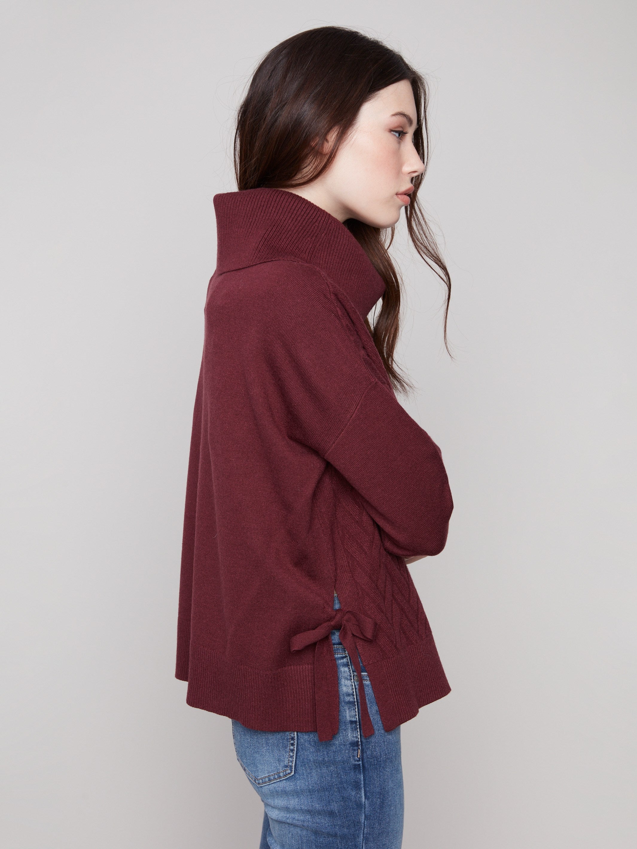 Elegant cabernet sweater with drop shoulders and chevron pattern for a relaxed yet chic look. By Charlie B.