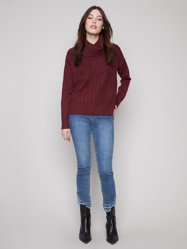 Sophisticated cabernet sweater with side slit and tie detail adds a unique touch to your wardrobe. By Charlie B.