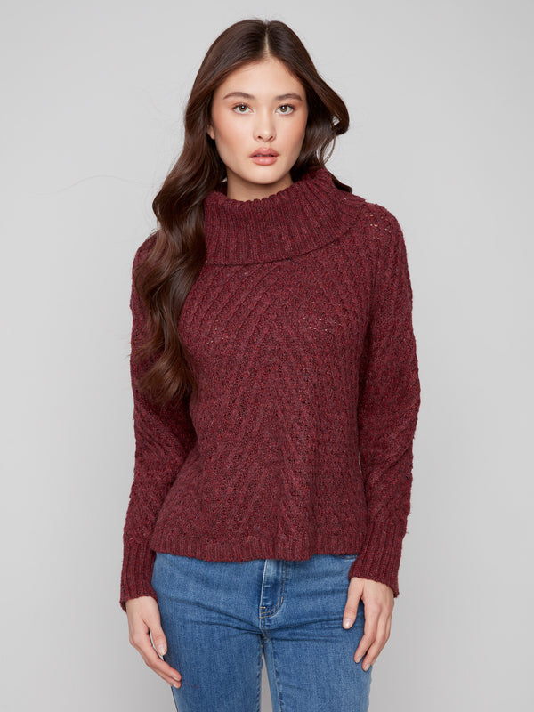Cabernet sweater with a cozy cowl neckline and intricate cable knit design, offering a stylish look by Charlie B.