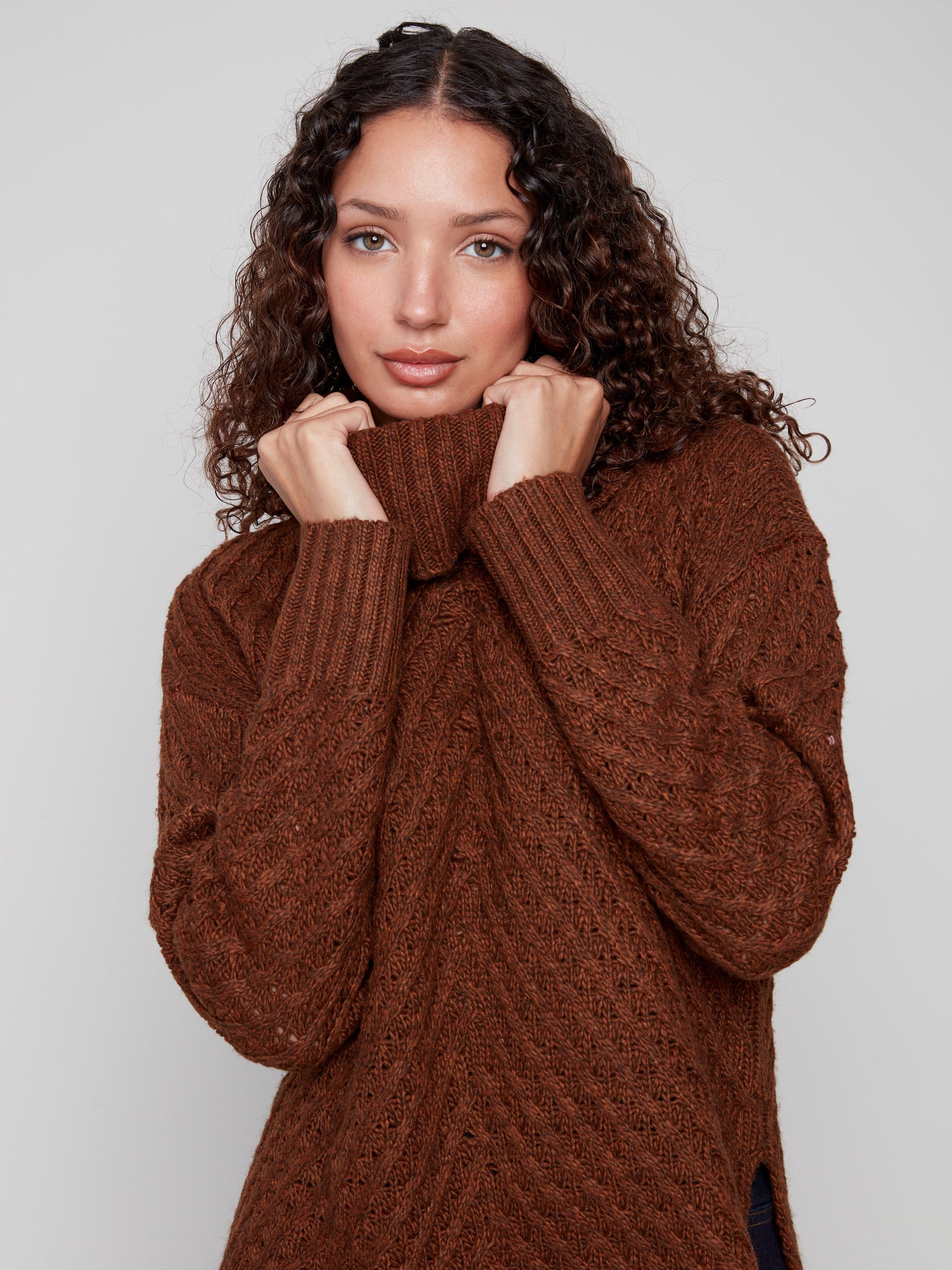 Elegant sepia knit with intricate cowl neckline design by Charlie B.