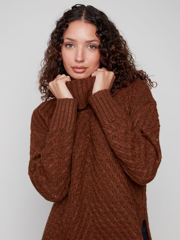 Elegant sepia knit with intricate cowl neckline design by Charlie B.