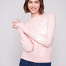 Heather Ballet sweater with ribbed cuffs and hem, featuring floral soutache accents for a chic touch by Charlie B.