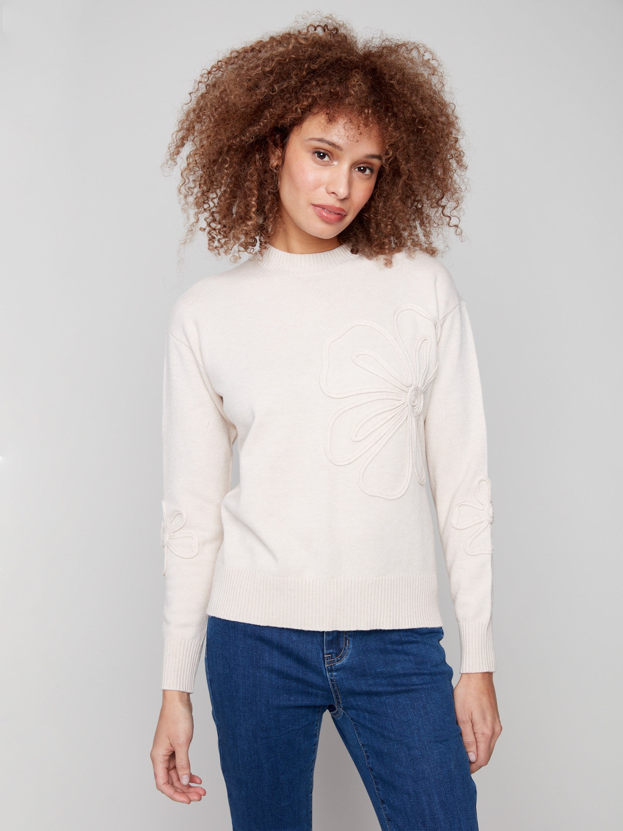 Heather Oat sweater featuring a classic crew neck design and elegant floral soutache embellishments by Charlie B.