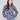 Navy blue sweater with dolman sleeves, featuring a floral jacquard pattern for a stylish look by Charlie B.