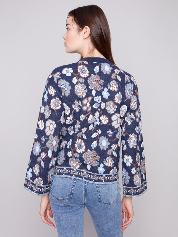 Elegant navy blue sweater with unique dolman sleeves and a beautiful floral pattern by Charlie B.