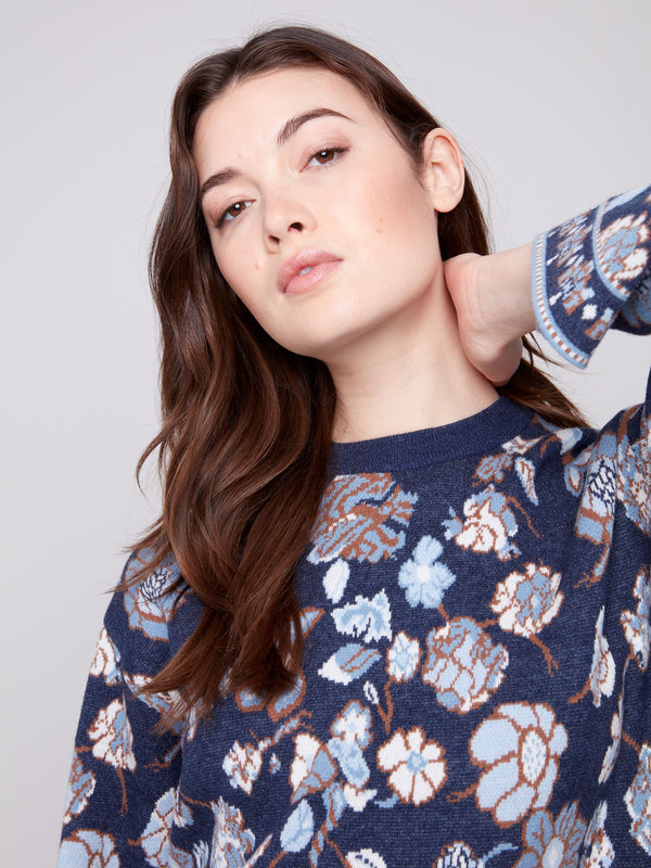 Cozy navy blue sweater featuring delicate floral patterns and trendy dolman sleeves by Charlie B.