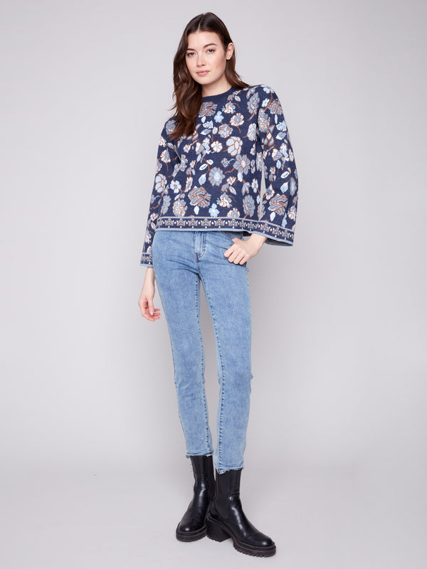 Fashionable crew neck navy blue sweater highlighted by its exquisite floral jacquard motif by Charlie B.